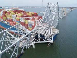 Baltimore bridge collapse: Huge crane put in place to remove debris as crews assess damage