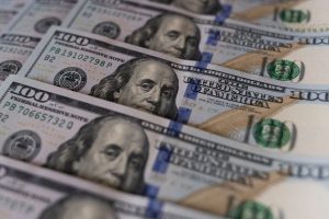 Dollar rises to five-month high, puts heat on yen