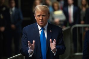 On first day of Trump hush money trial, prosecutors say he corrupted 2016 election