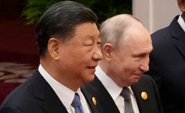 Putin and Xi wrap up talks with tea ceremony in a Beijing park