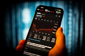 Sensex, Nifty touch record highs before closing flat