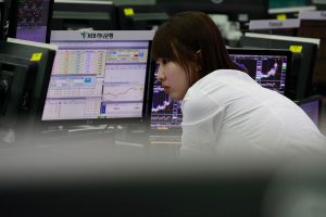 Japan's economy skids, clouding BOJ's rate hike plans