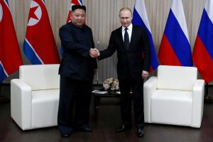Putin flies into North Korea with promise to back it against the US