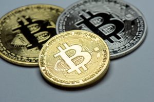 Bitcoin slides to four-month lows, ether sinks 8%