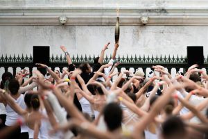 Olympic flame dances past Moulin Rouge in Paris torch relay