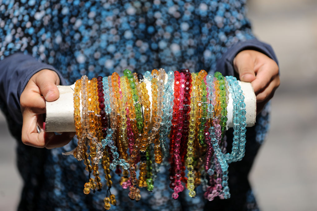 Gazan child makes beads, dreams of rebuilding what was destroyed in Gaza