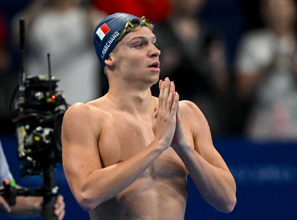 Paris 2024: ‘Hurting’ Marchand restarts pool party in 200m individual medley