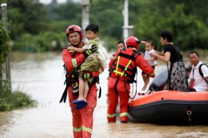 Rescuers in China race to find the missing, seal dykes after deadly floods