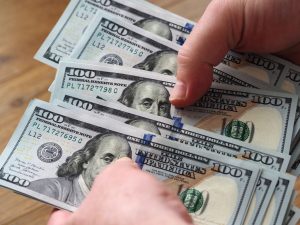 Dollar drops as Fed cuts rates by half a percentage point