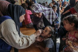 Israeli attacks in Gaza kill 35 Palestinians but pauses allow third day of polio vaccination