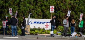 Boeing freezes hiring, weighs furloughs as 30,000 workers strike