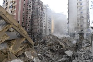 Israel blocks Lebanon's main crossing to Syria, targets Hezbollah in Beirut