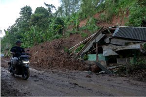 Landslides in Indonesia's Sumatra kill at least 27, rescuers search for missing