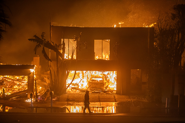 Los Angeles firefighters make progress as intense winds ease