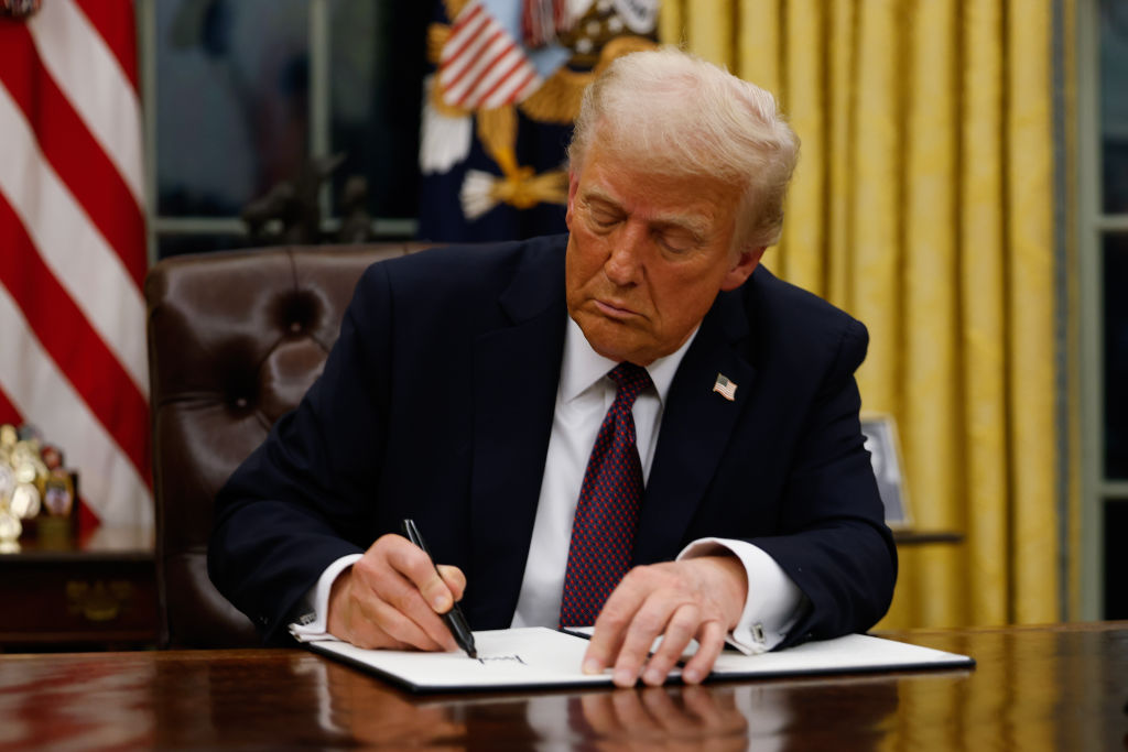 WASHINGTON, DC - JANUARY 20: President Donald Trump signs executive orders in the Oval Office of the White House on January 20, 2025 in Washington, DC. Trump takes office for his second term as the 47th president of the United States. (Photo by Anna Moneymaker/Getty Images)