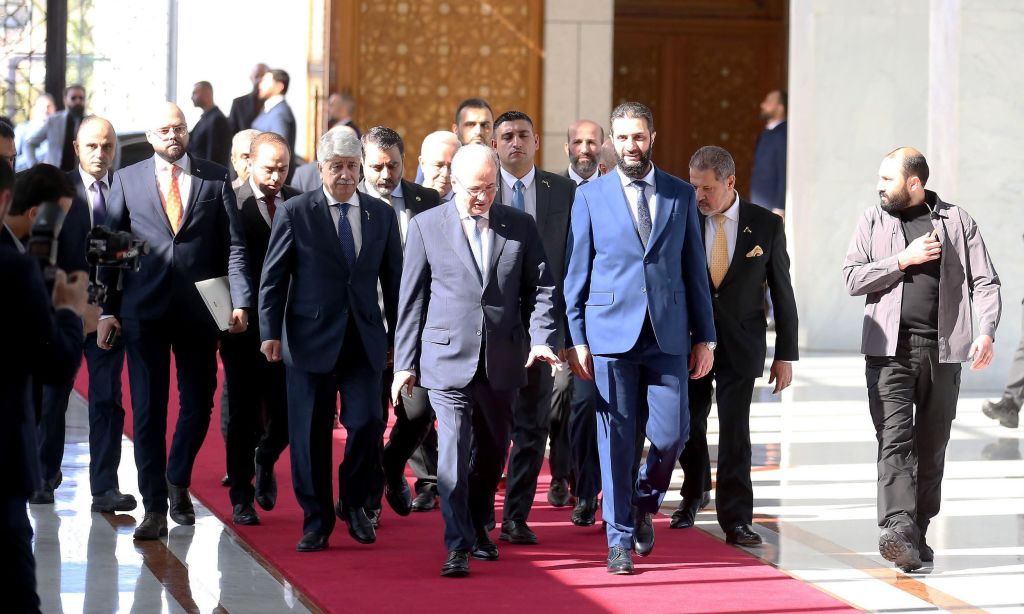 Palestinian Prime Minister Mohammed Mustafa (C-L) is welcomed by the Syria's new administration leader Ahmed al-Sharaa (C-R) during an official visit in Damascus, Syria on January 28, 2025. Photo by Palestinian Prime Ministry/ Handout/Anadolu via Getty Images