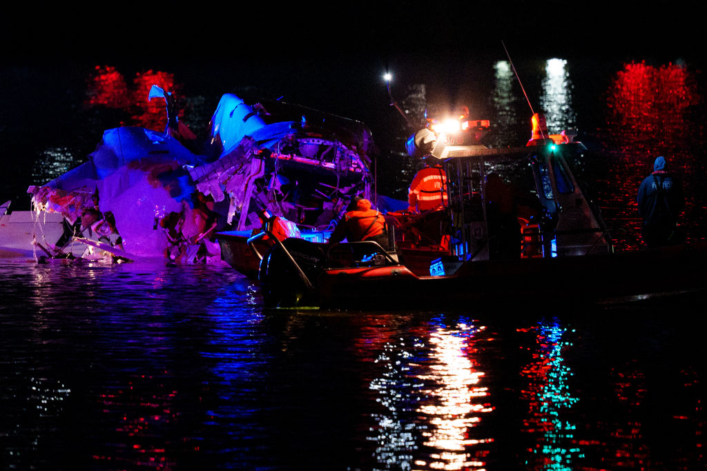 Emergency response teams including Washington, DC Fire and EMS, DC Police and others, assess airplane wreckage in the Potomac River near Ronald Reagan Washington Airport on January 30, 2025 in Arlington, Virginia. Photo by Andrew Harnik/Getty Images