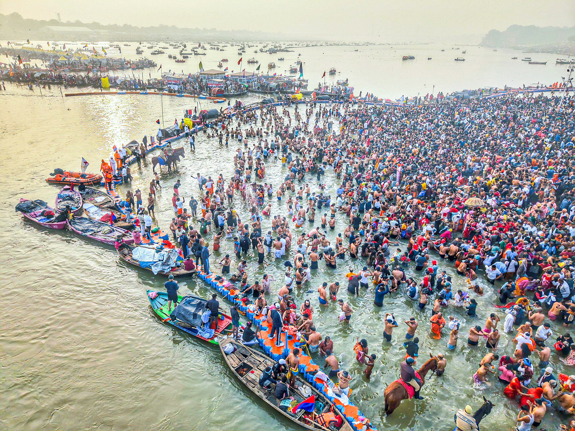 Maha Kumbh: Devotees take holy dip at Triveni Sangam on the fourth day