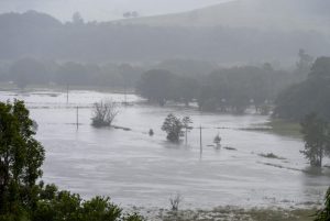 Torrential rain ravages Australian towns, thousands brace for isolation