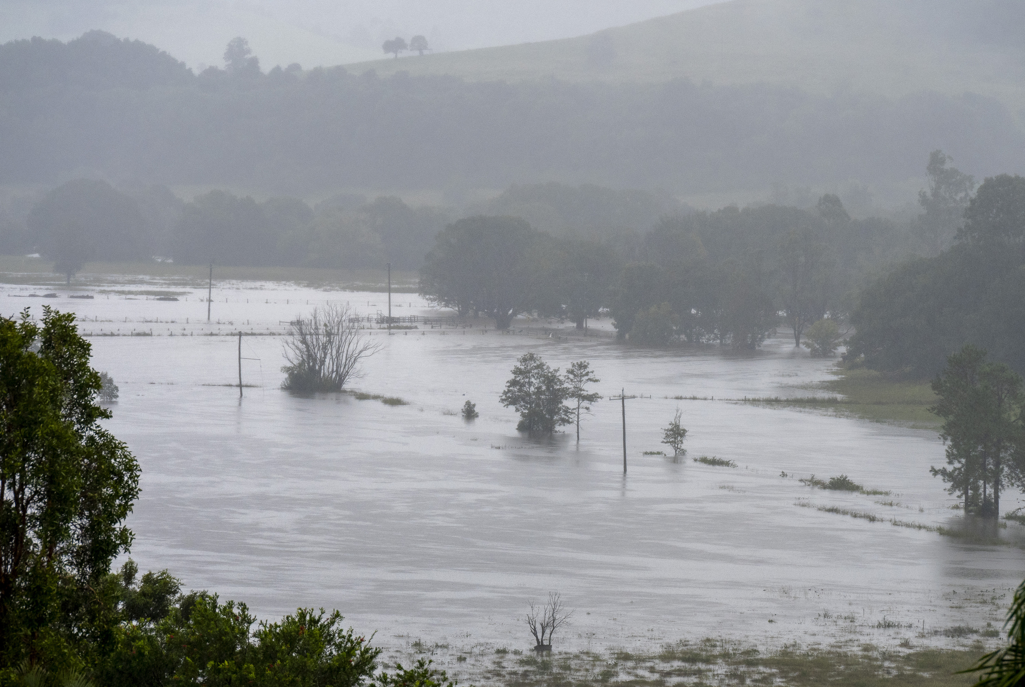Torrential rain ravages Australian towns, thousands brace for isolation