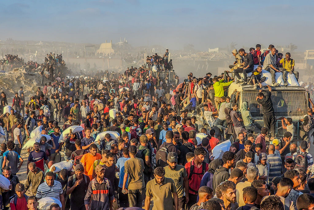 Israeli tanks kill 59 people in Gaza crowd trying to get food aid, medics say