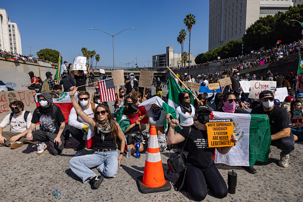 US cities brace for more protests as parts of Los Angeles placed under curfew