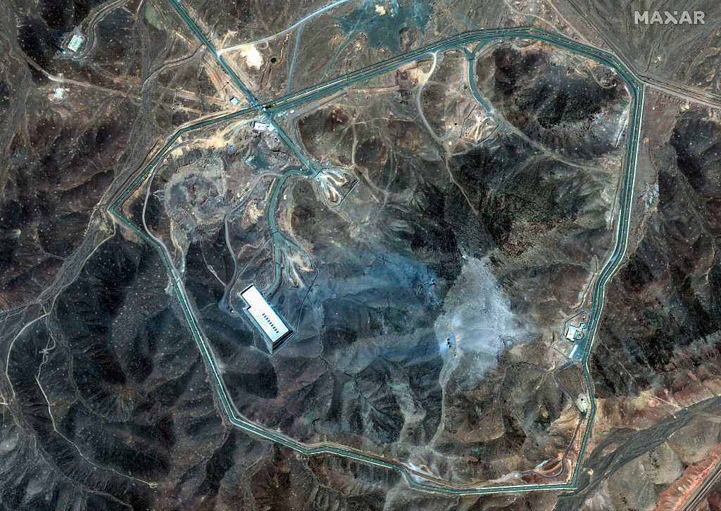Maxar Satellite Imagery collected this morning shows extensive damage at the Fordow underground complex. Several large craters are visible across the ridge, and a wide area is covered in grey-blue ash, consistent with airstrike aftermath. Please use: Satellite image (c) 2025 Maxar Technologies.