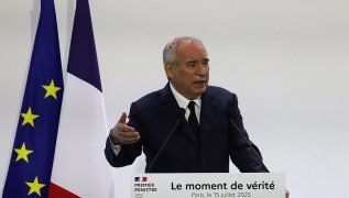 French PM starts talks with opposition, seeking to avert government collapse