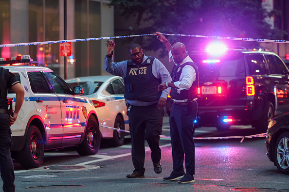 Gunman kills four, including police officer, in Manhattan skyscraper, then takes own life