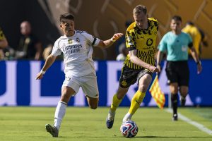 Real Madrid survive Dortmund scare to reach Club World Cup semis