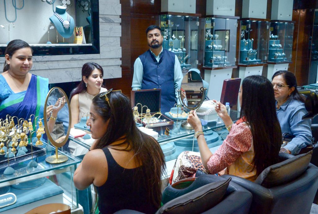 Amritsar: People purchase gold jewellery at a jewellery shop
