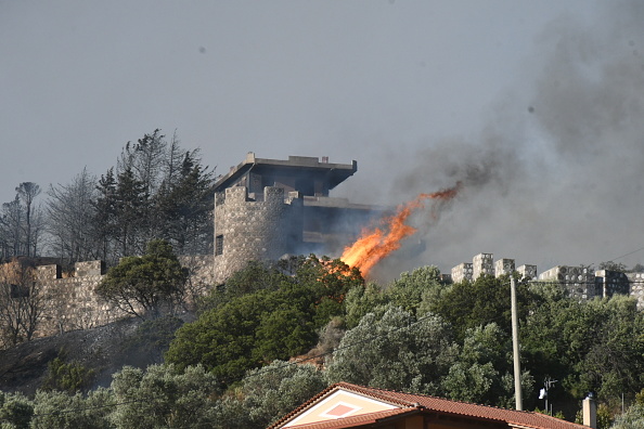 Wildfires scorch Greece for a second day, thousands evacuated