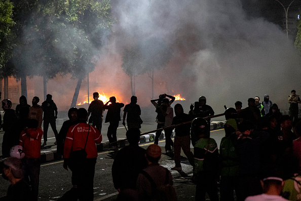 Three dead as Indonesian protesters set fire to regional parliament building