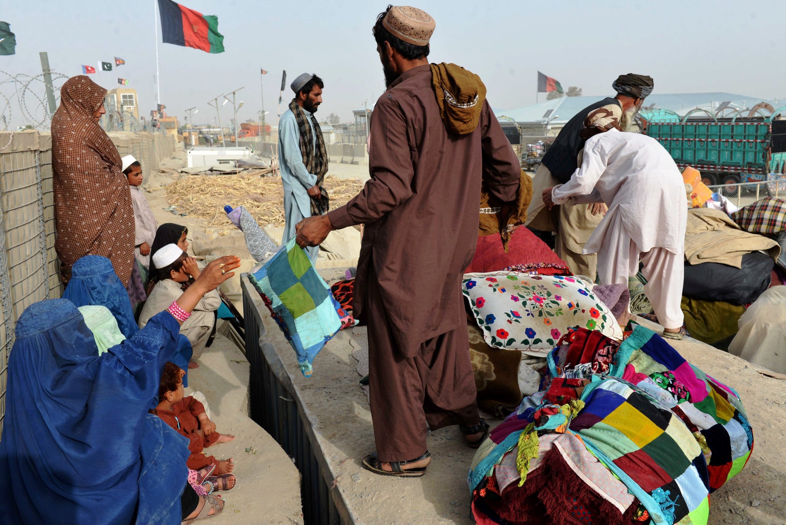 Evicted Afghan refugees huddle in Islamabad park, dreading return home
