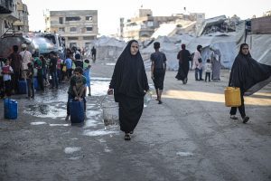 Families leave Gaza City after night of bombardment, Israelis protest