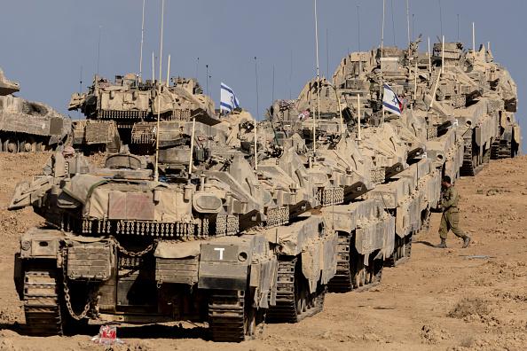 Tanks thrust deeper into Gaza, medics say many injured trapped