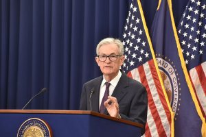 Fed's Powell strikes middle path on inflation, jobs, as others take sides