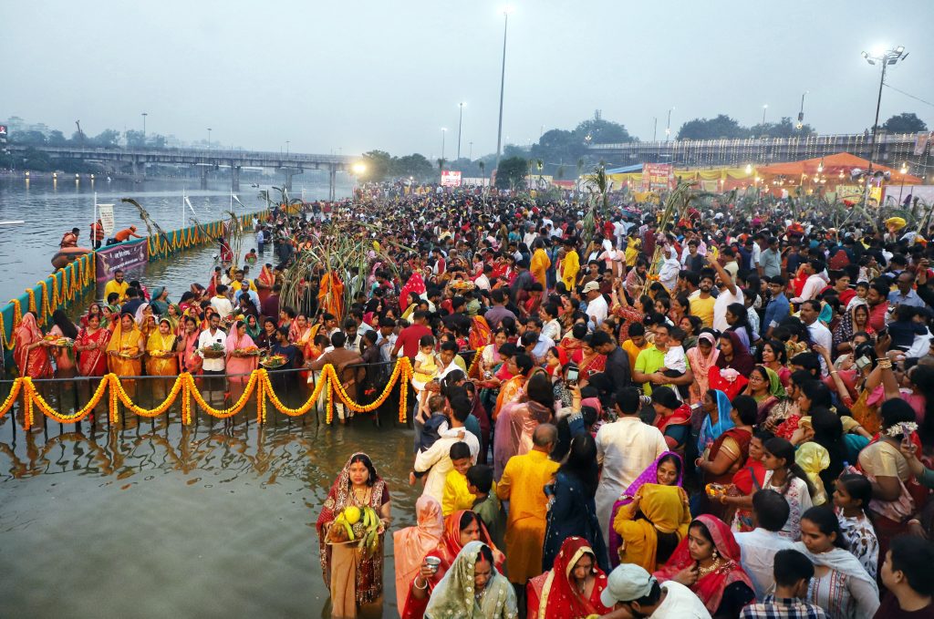 Devotees perform rituals during Chhath Puja