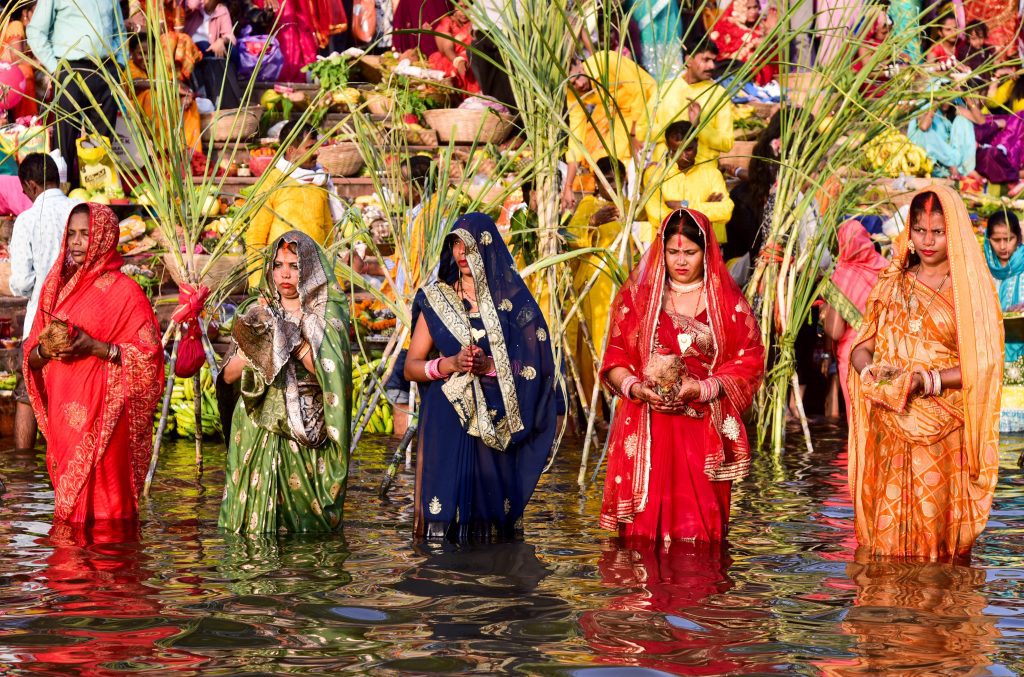 Devotees perform rituals during Chhath Puja
