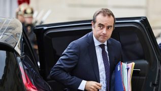 French PM survives no-confidence votes after making pension concession