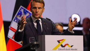 Macron tasks his outgoing PM with holding last-ditch talks to end crisis