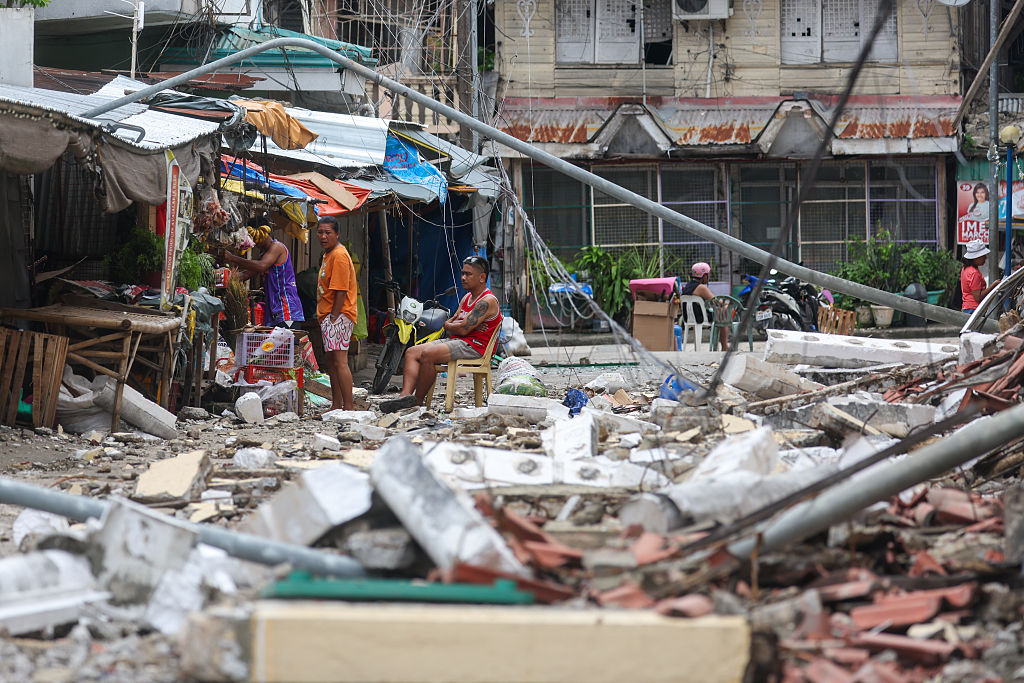 Philippines quake death toll rises to 69 , official says