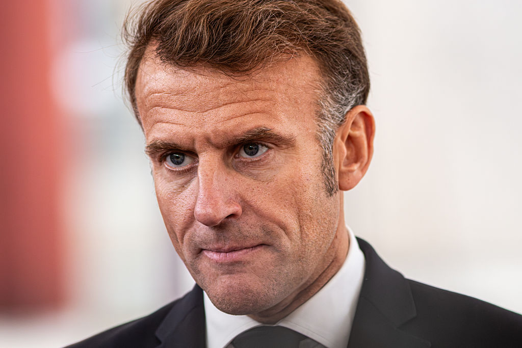 Macron wanders alone by the Seine as grip on his future slips away