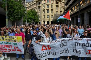 Greek ferries and trains halted as thousands protest over working hours