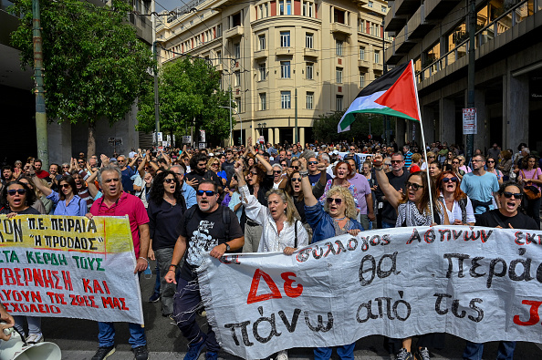 Greek ferries and trains halted as thousands protest over working hours