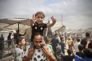 Gazans stream towards wrecked homes as Israeli forces pull back under ceasefire
