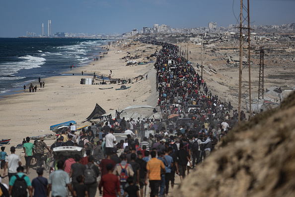 Gazans trek to ruined homes as Israeli forces pull back under ceasefire
