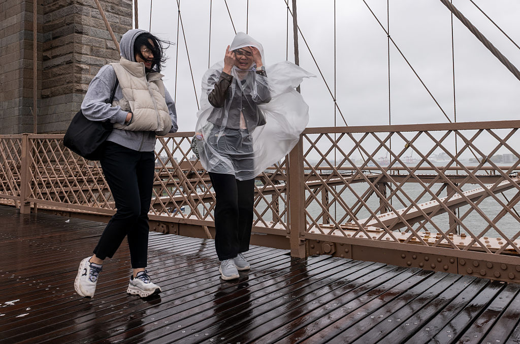 Heavy rains in New York kill two, disrupt flights