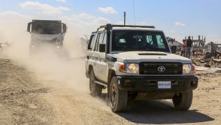 Aid trucks roll into Gaza as dispute over hostage bodies is paused