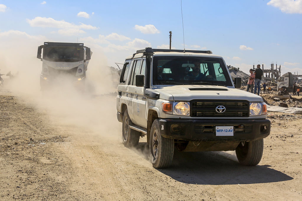Aid trucks roll into Gaza as dispute over hostage bodies is paused